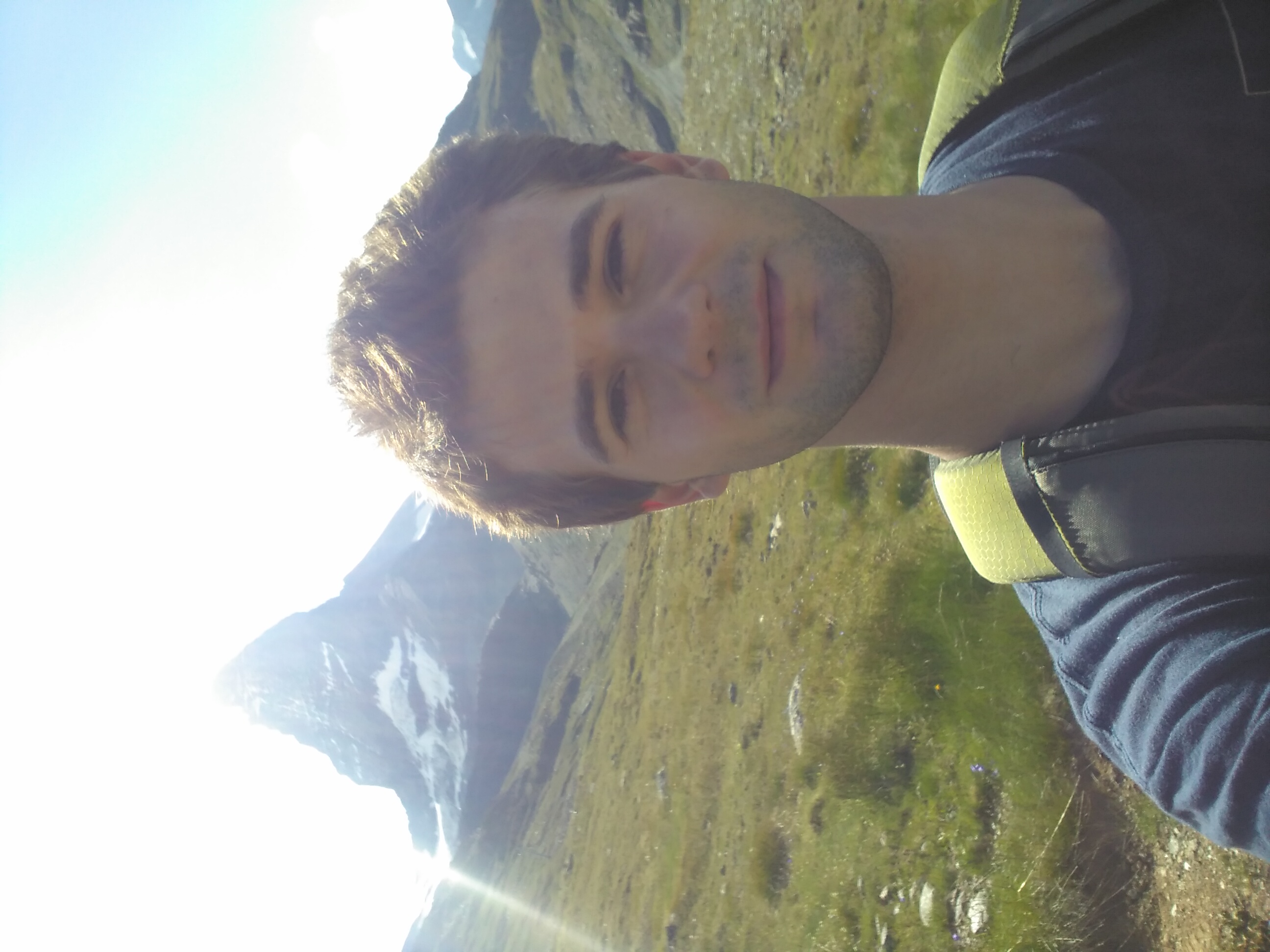 Oryn outside with a big mountain in the background.