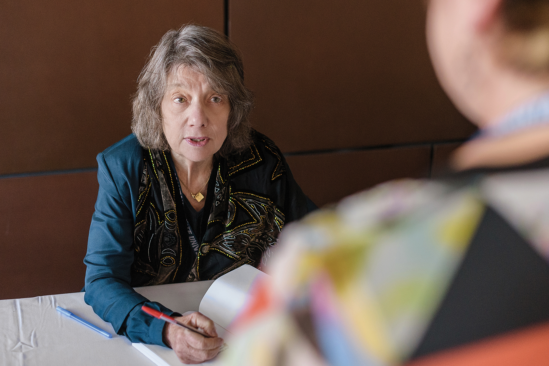 woman in discussion at a table