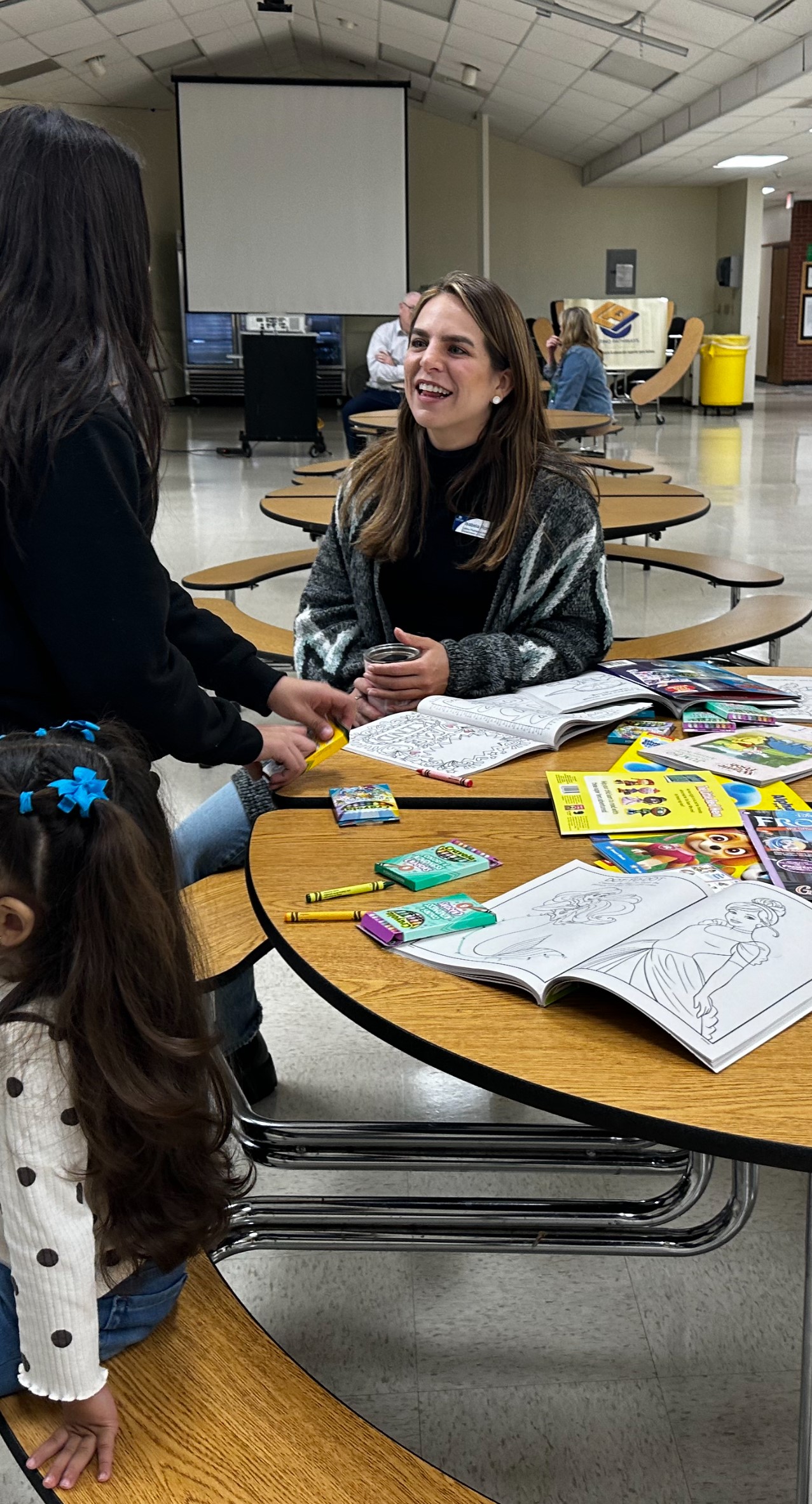 Romero speaking with families during Noche Familia