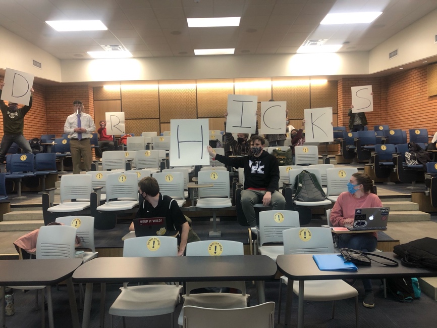 Students holding letters D R period H I C K S around Dr. Joe Hicks.