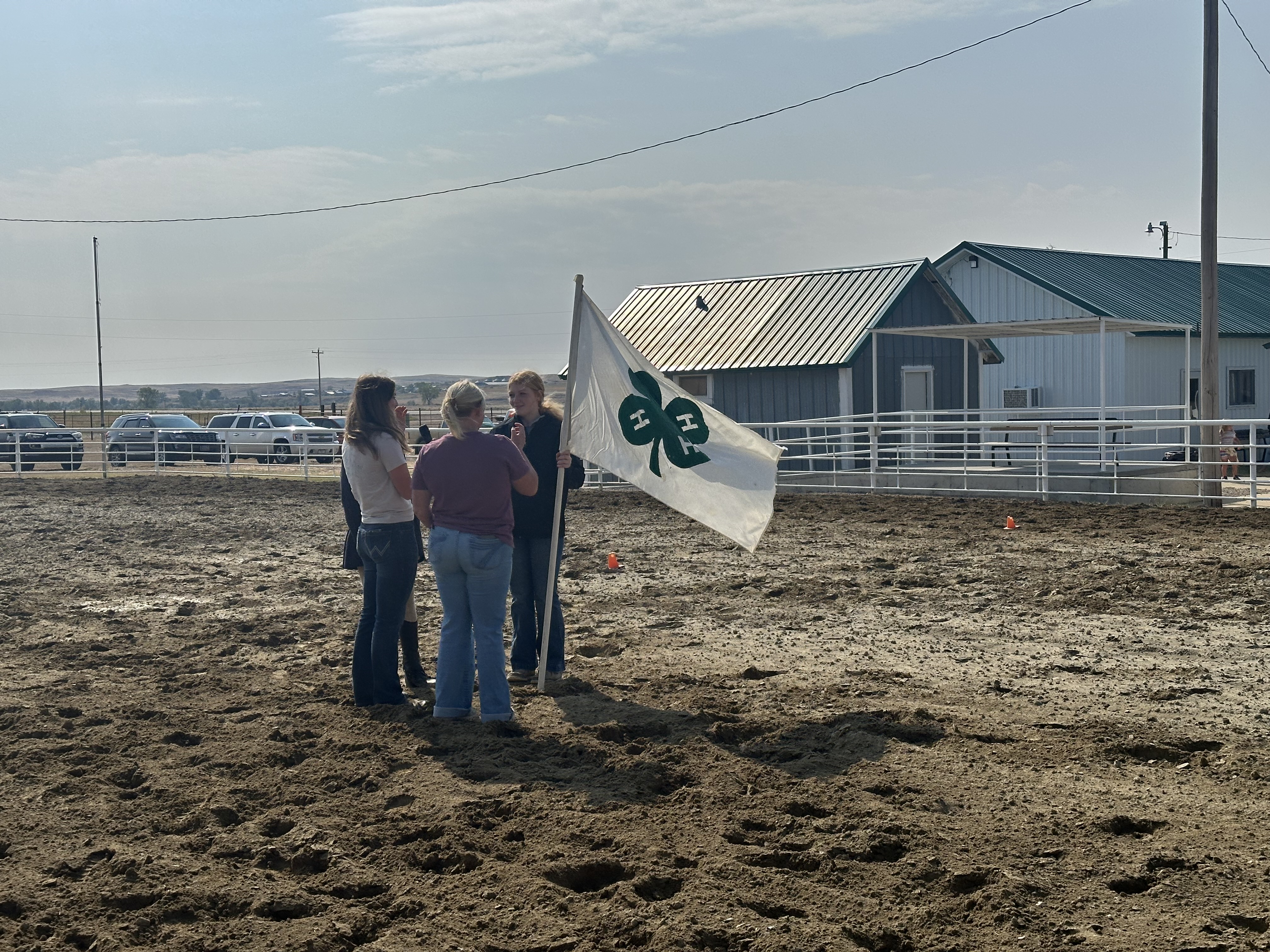Members at the Garfield County Fair leading the Community in the 4-H Pledge to kick off the day at the County Fair. 