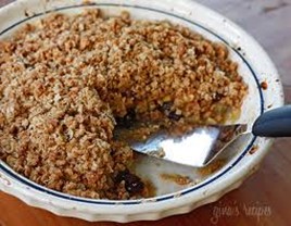 Apple, peach, or cherry crisp in a round baking dish. 