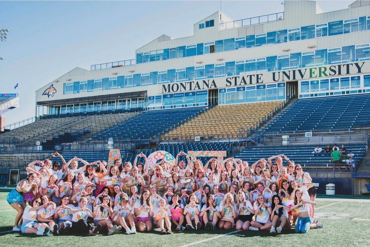 Sorority members standing together in Bobcat Stadium