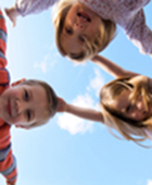 children looking down while jumping