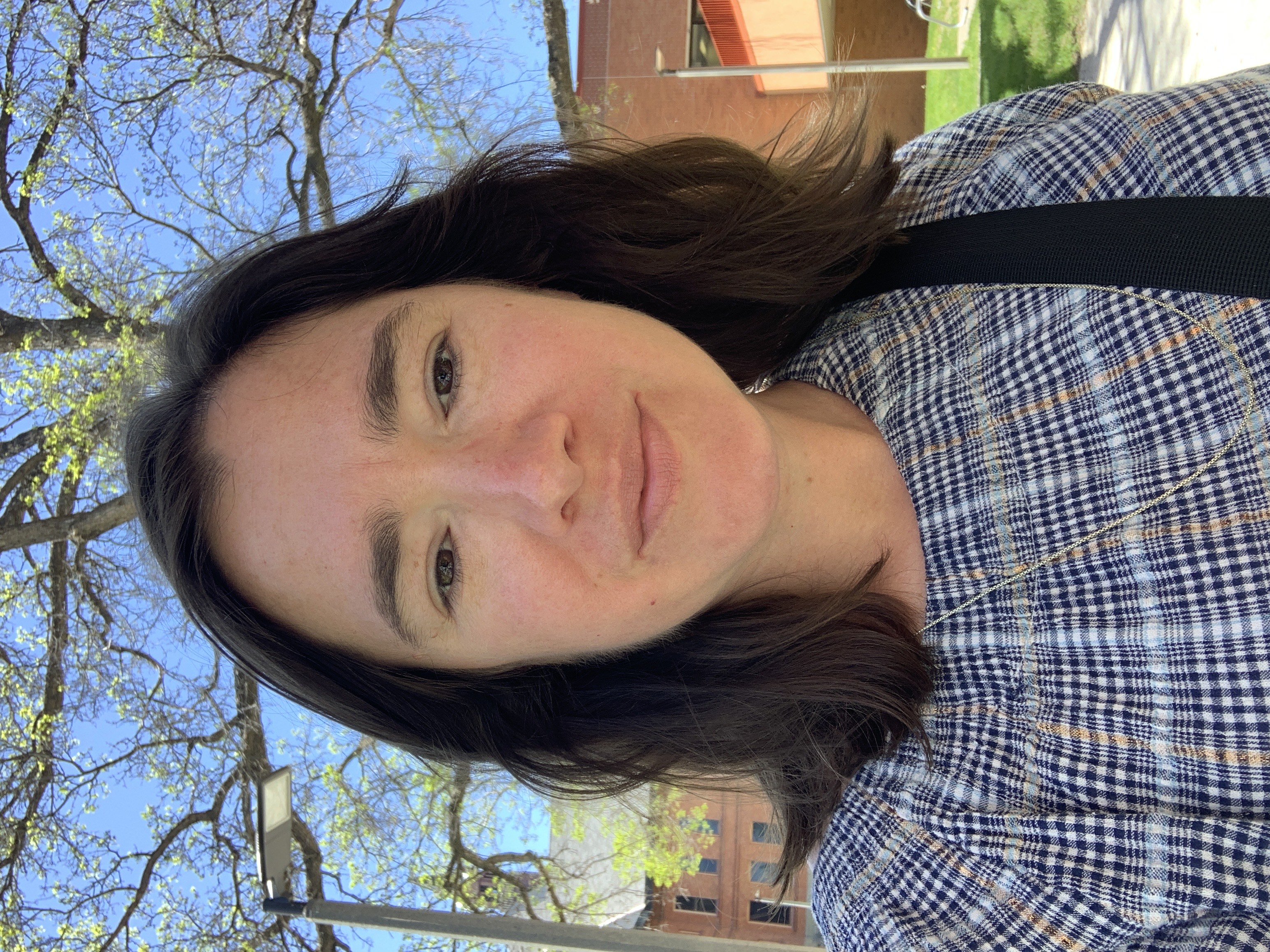 Outdoor headshot of online program manager, Jenny Hatchadorian
