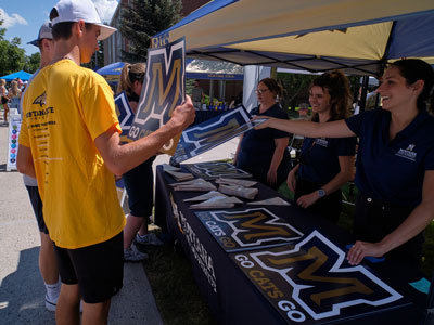 Image if the Marketing staff interacting with students during Catapalooza