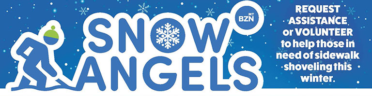 A person shoveling the snow with the words "snow angel"