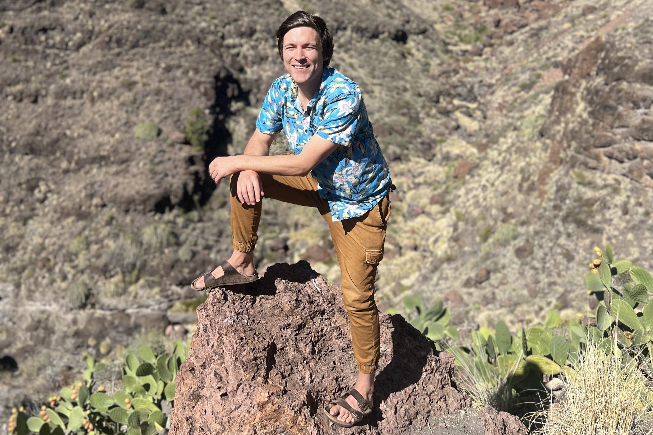 man standing on rock